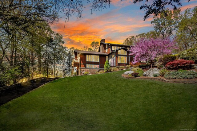 81 Georges Ln, Monroe, CT 06468 - view of front of house featuring a chimney and a yard