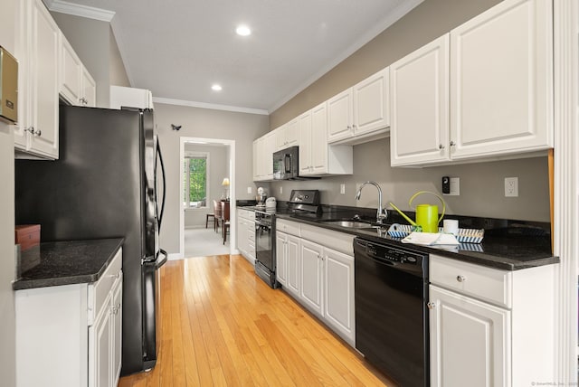 5 Harwich Ln Unit 5, West Hartford, CT 06117 - kitchen featuring black appliances, a sink, white cabinets, dark countertops, and ornamental molding