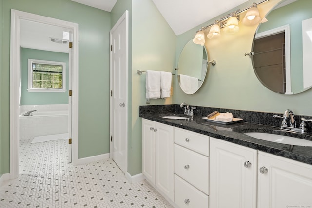 5 Harwich Ln Unit 5, West Hartford, CT 06117 - bathroom with baseboards, double vanity, and a bathtub