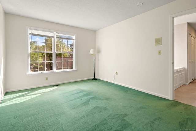 5 Harwich Ln Unit 5, West Hartford, CT 06117 - spare room featuring light carpet, baseboards, and a textured ceiling