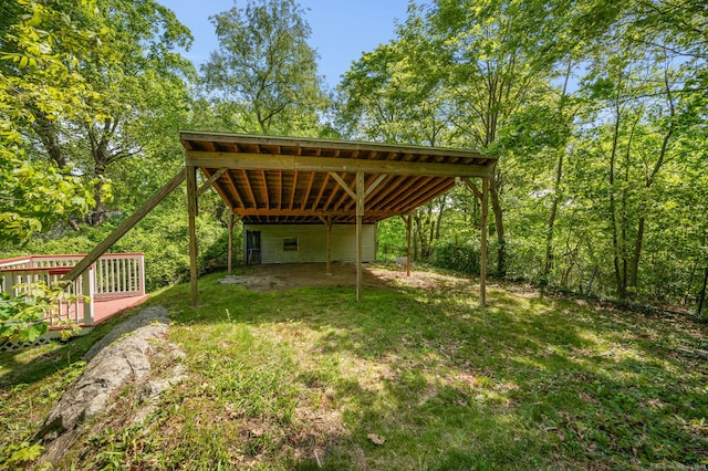 29 E Cliff St, Norwich, CT 06360 - view of grassy yard featuring a deck and a carport