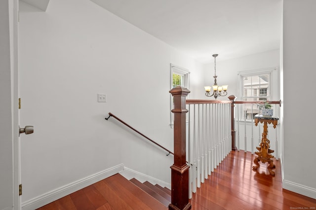 29 E Cliff St, Norwich, CT 06360 - staircase with a chandelier, hardwood / wood-style flooring, and plenty of natural light