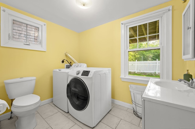 29 E Cliff St, Norwich, CT 06360 - laundry room featuring washer and clothes dryer, baseboards, and light marble finish floors