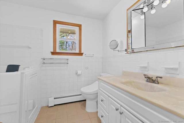 bathroom featuring a baseboard radiator, tile walls, tile patterned flooring, vanity, and toilet