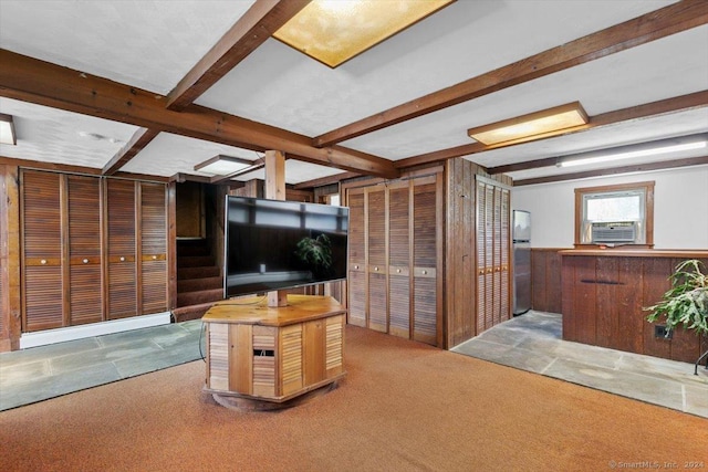 carpeted living room with beamed ceiling and cooling unit