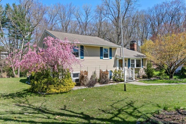 26 Jodi Dr, Wallingford, CT 06492 - tri-level home with a chimney and a front yard