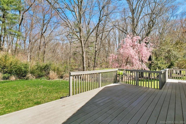 wooden terrace with a yard