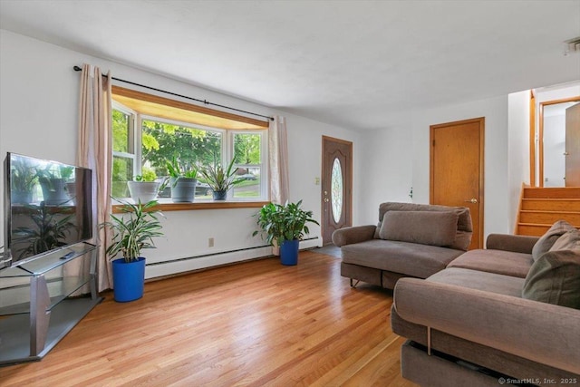 26 Jodi Dr, Wallingford, CT 06492 - living room with baseboard heating, light wood-style flooring, and stairway