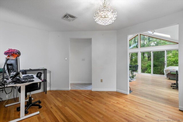 26 Jodi Dr, Wallingford, CT 06492 - home office featuring light wood finished floors, baseboards, and a chandelier