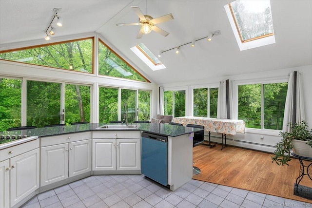 26 Jodi Dr, Wallingford, CT 06492 - kitchen featuring track lighting, dishwasher, a skylight, a baseboard heating unit, and light tile patterned flooring