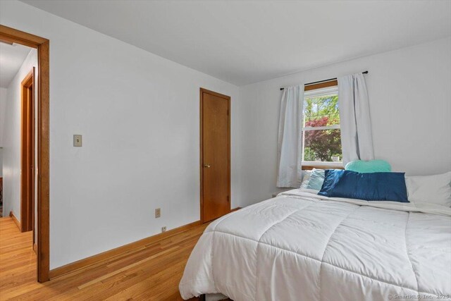 26 Jodi Dr, Wallingford, CT 06492 - bedroom with light wood-type flooring and baseboards