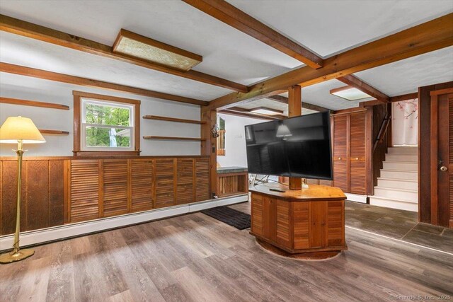 26 Jodi Dr, Wallingford, CT 06492 - living room featuring wooden walls, beam ceiling, wainscoting, wood finished floors, and stairway