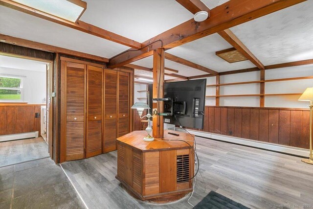 26 Jodi Dr, Wallingford, CT 06492 - office area with a baseboard heating unit, wood walls, wainscoting, wood finished floors, and beamed ceiling