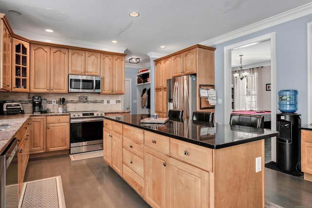 kitchen with appliances with stainless steel finishes, light brown cabinets, crown molding, dark wood finished floors, and recessed lighting