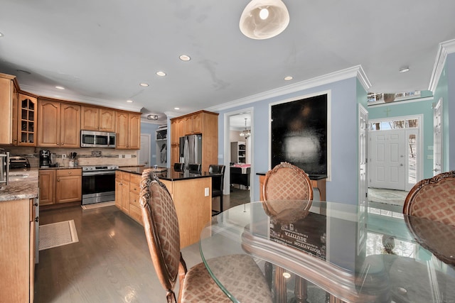 kitchen featuring stainless steel appliances, recessed lighting, glass insert cabinets, decorative backsplash, and crown molding