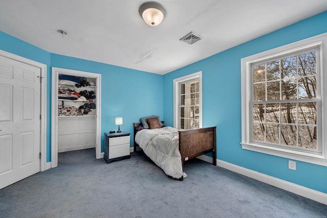 bedroom featuring carpet and baseboards