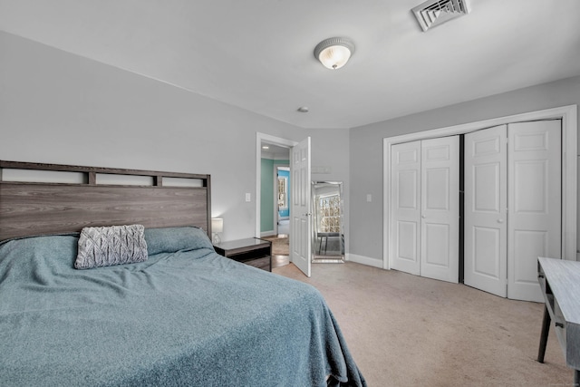 bedroom with carpet floors, a closet, and baseboards