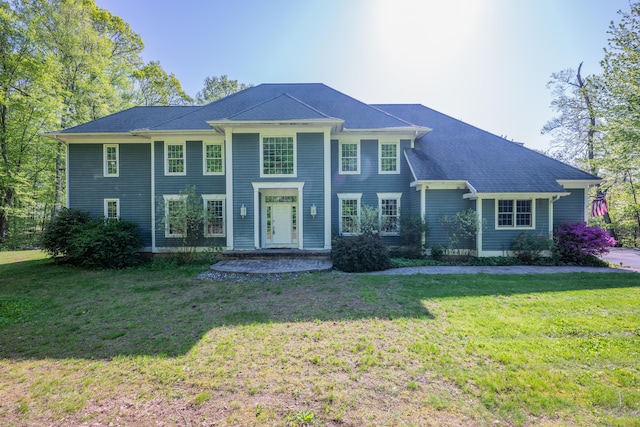 colonial home with a front lawn