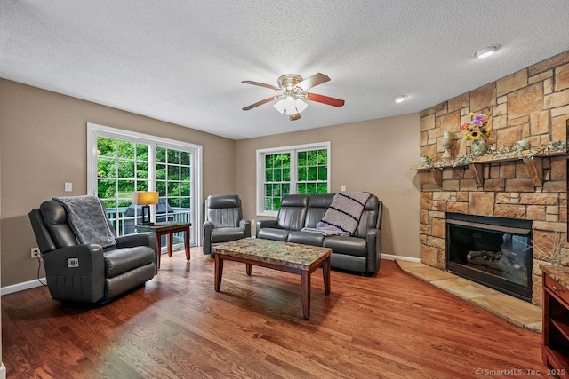 24 Secret Mountain Trl, Canton, CT 06019 - living area featuring a ceiling fan, wood finished floors, a textured ceiling, and plenty of natural light