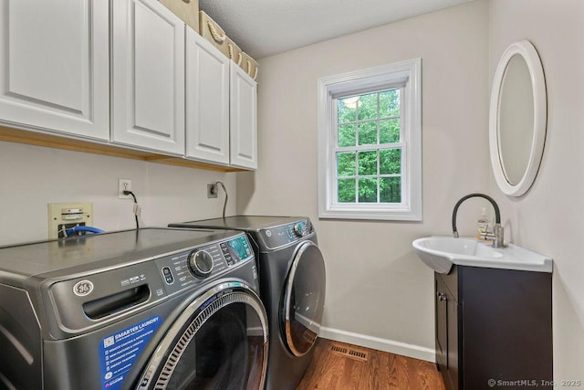 24 Secret Mountain Trl, Canton, CT 06019 - laundry room featuring cabinet space, washing machine and dryer, baseboards, and dark wood finished floors