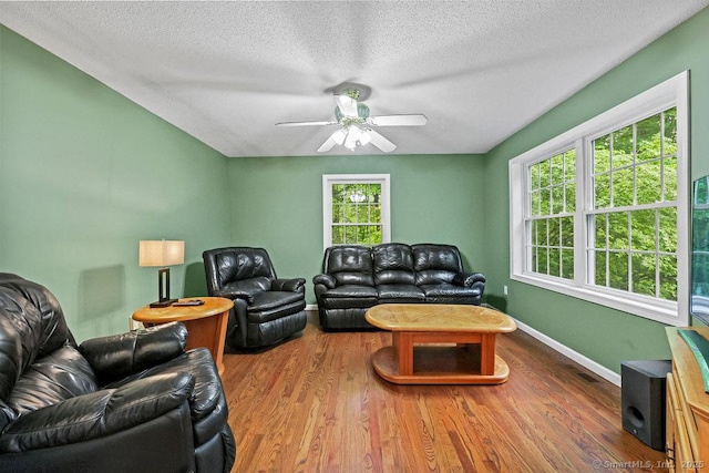 24 Secret Mountain Trl, Canton, CT 06019 - living area with a ceiling fan, wood finished floors, a textured ceiling, and baseboards