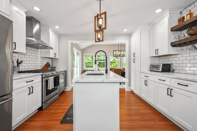 48 Sprucedale Dr, Waterbury, CT 06706 - kitchen with appliances with stainless steel finishes, wall chimney exhaust hood, a sink, open shelves, and lofted ceiling