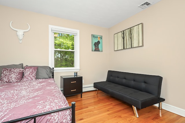 48 Sprucedale Dr, Waterbury, CT 06706 - bedroom featuring a baseboard radiator, light wood-style flooring, and baseboards