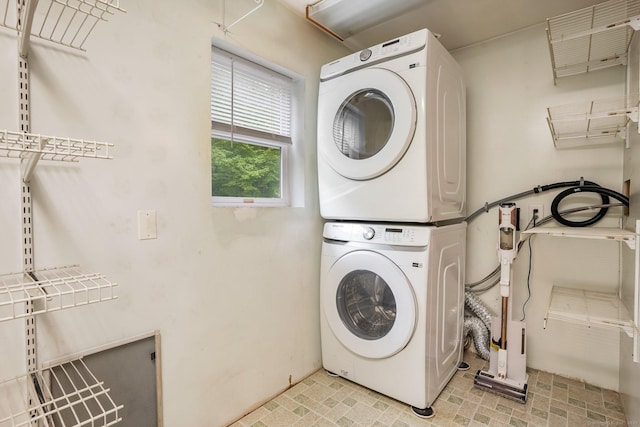 387 New London Tpke, Stonington, CT 06378 - washroom featuring stacked washer / dryer