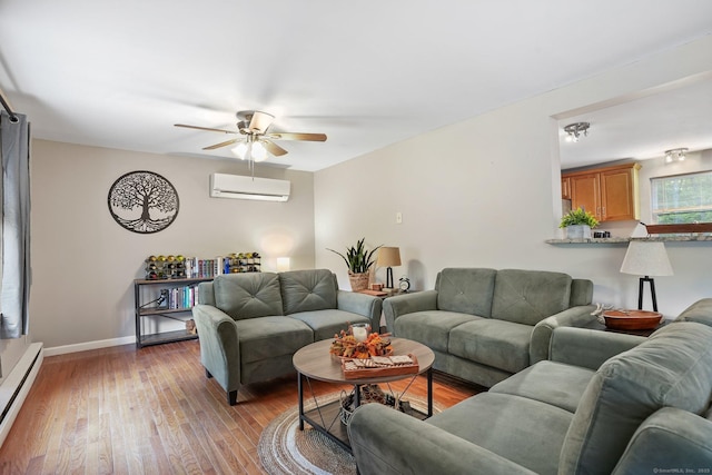 387 New London Tpke, Stonington, CT 06378 - living area with a baseboard radiator, a wall mounted AC, hardwood / wood-style floors, a ceiling fan, and baseboards