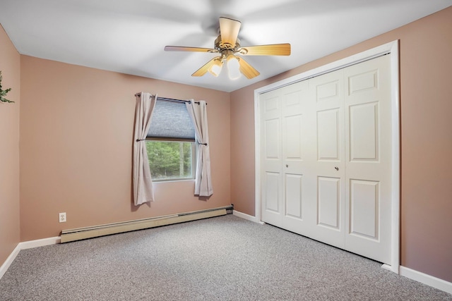 387 New London Tpke, Stonington, CT 06378 - unfurnished bedroom featuring a baseboard radiator, carpet floors, a closet, and baseboards