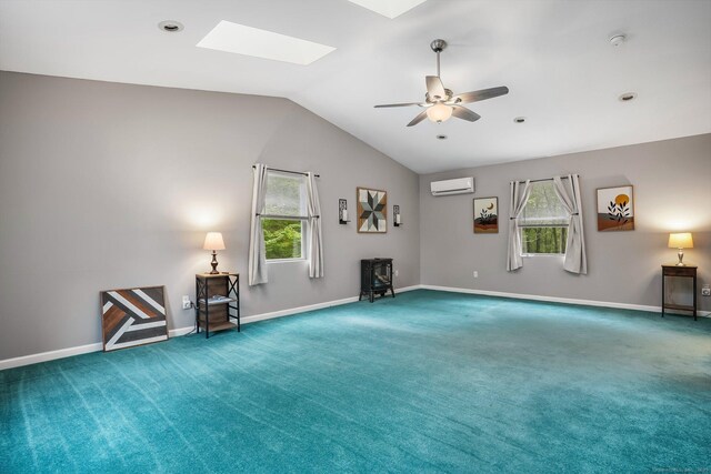 387 New London Tpke, Stonington, CT 06378 - unfurnished room with a wall mounted air conditioner, carpet, plenty of natural light, vaulted ceiling, and a skylight
