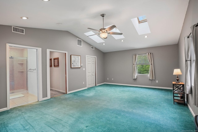 387 New London Tpke, Stonington, CT 06378 - unfurnished bedroom featuring a skylight, carpet flooring, vaulted ceiling, baseboards, and recessed lighting