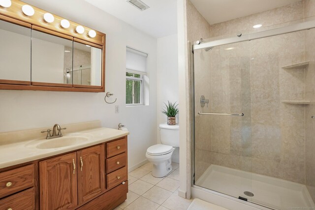 387 New London Tpke, Stonington, CT 06378 - full bath with vanity, toilet, a shower stall, and tile patterned floors