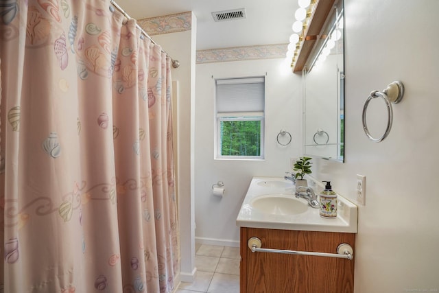 387 New London Tpke, Stonington, CT 06378 - bathroom with tile patterned floors, double vanity, and baseboards