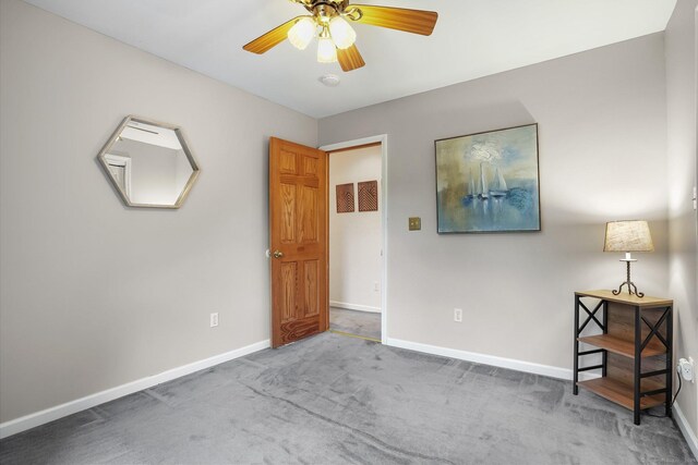 387 New London Tpke, Stonington, CT 06378 - unfurnished bedroom featuring baseboards, carpet floors, and ceiling fan