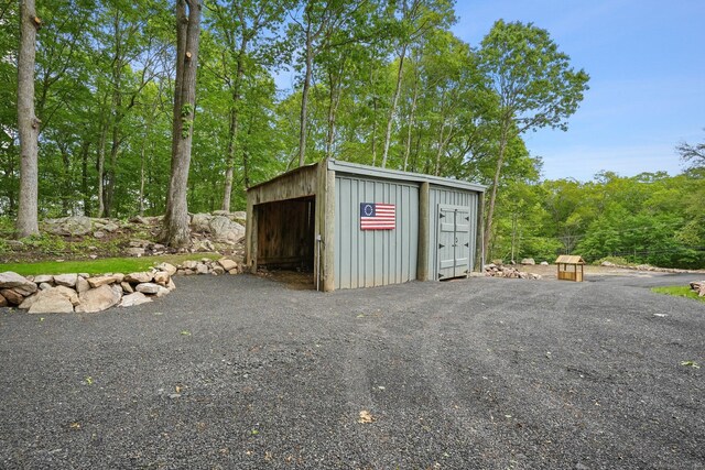 387 New London Tpke, Stonington, CT 06378 - view of outbuilding featuring a view of trees