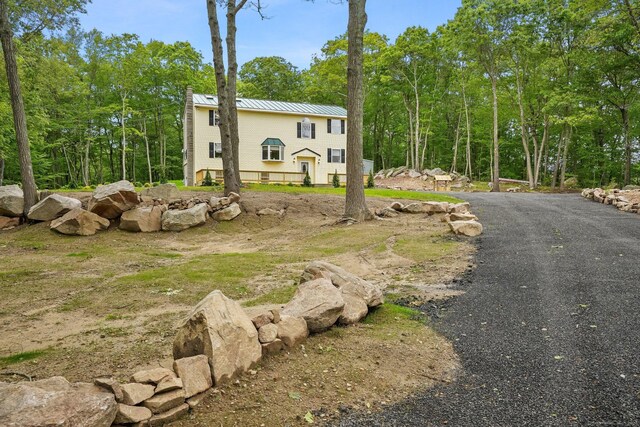 387 New London Tpke, Stonington, CT 06378 - view of front of property featuring a standing seam roof and metal roof