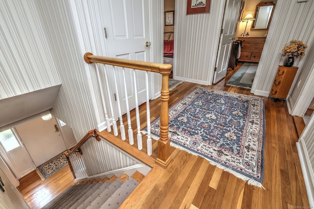 481 Clearbrook Rd, Orange, CT 06477 - entrance foyer featuring wood finished floors, wallpapered walls, stairs, and baseboards