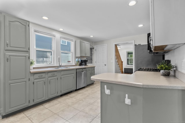 43 Atwater St, Milford, CT 06460 - kitchen featuring stainless steel dishwasher, gray cabinets, light tile patterned flooring, healthy amount of natural light, and recessed lighting