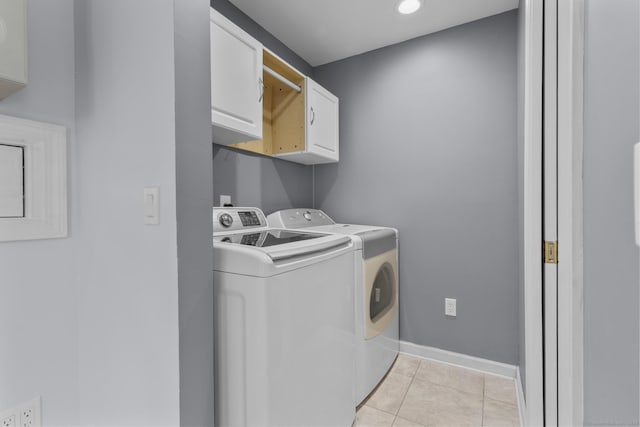 43 Atwater St, Milford, CT 06460 - washroom featuring cabinet space, separate washer and dryer, and light tile patterned flooring