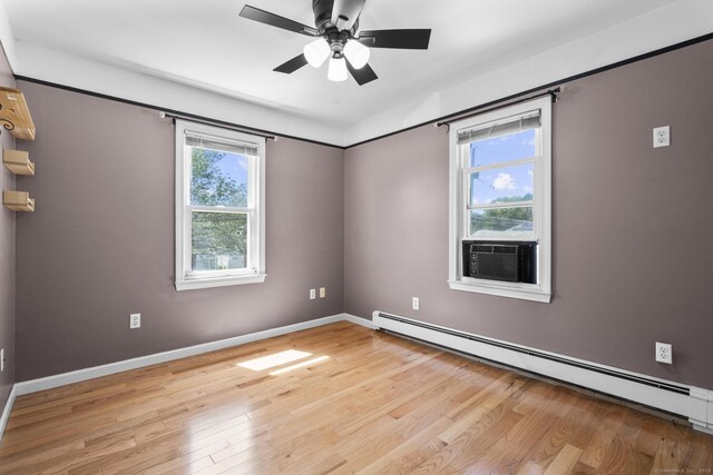 43 Atwater St, Milford, CT 06460 - unfurnished room with a baseboard heating unit, light wood-style flooring, a ceiling fan, and cooling unit