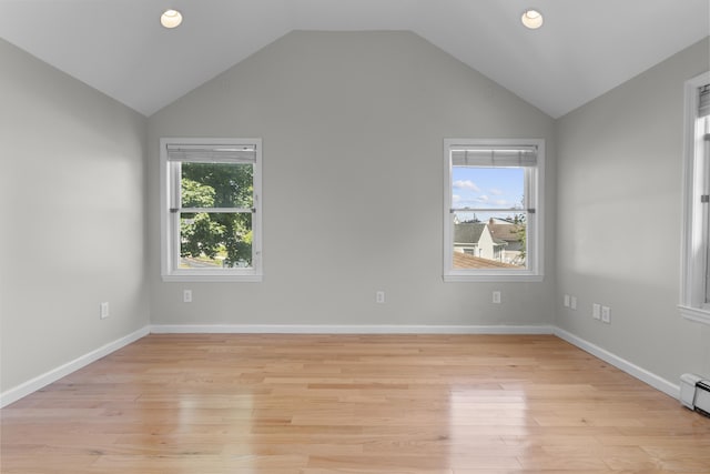 43 Atwater St, Milford, CT 06460 - spare room featuring lofted ceiling, light wood-style floors, recessed lighting, and a baseboard radiator