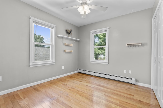 43 Atwater St, Milford, CT 06460 - empty room featuring baseboard heating, wood finished floors, and a ceiling fan
