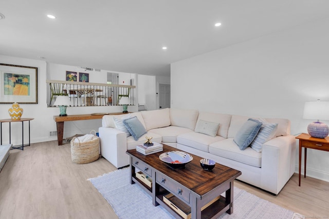 135 Gary Rd, Stamford, CT 06903 - living room with light wood-type flooring, recessed lighting, and baseboards
