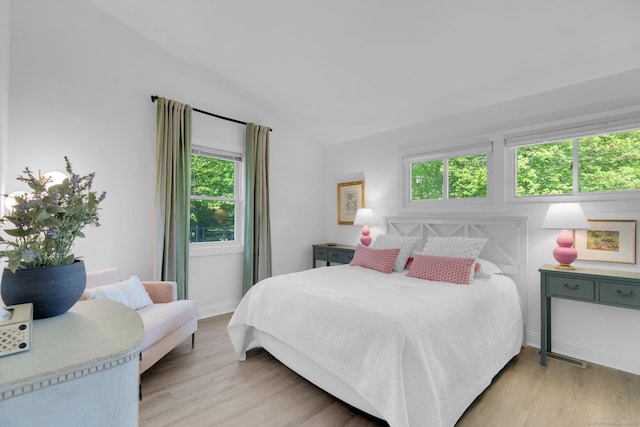 135 Gary Rd, Stamford, CT 06903 - bedroom with light wood-type flooring, vaulted ceiling, and baseboards