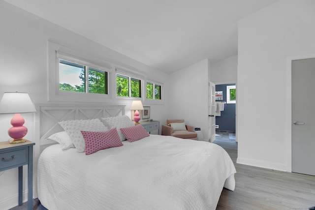 135 Gary Rd, Stamford, CT 06903 - bedroom featuring wood finished floors, lofted ceiling, and baseboards