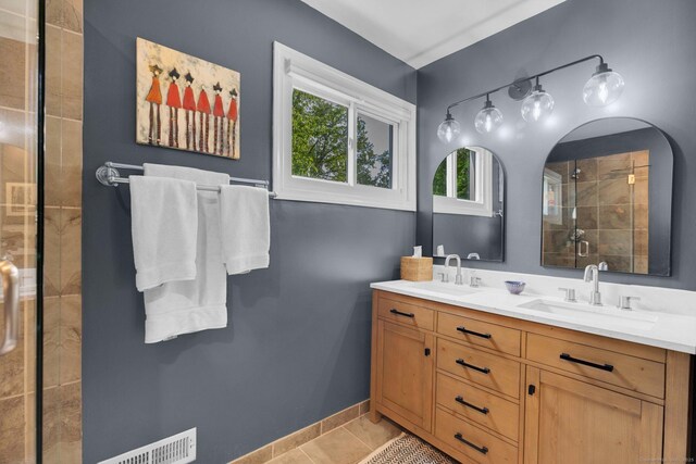 135 Gary Rd, Stamford, CT 06903 - bathroom with a shower stall, double vanity, and tile patterned floors