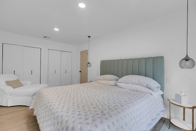 135 Gary Rd, Stamford, CT 06903 - bedroom with two closets, wood finished floors, recessed lighting, and baseboards