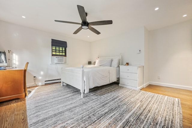 194 Josies Ring Rd, Monroe, CT 06468 - bedroom featuring a baseboard heating unit, light wood-style floors, cooling unit, baseboards, and recessed lighting