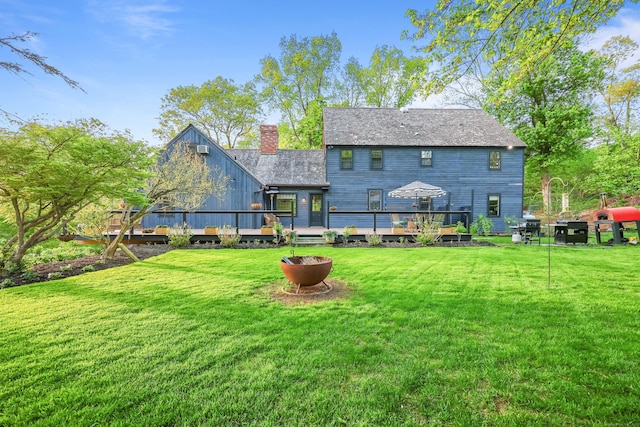 194 Josies Ring Rd, Monroe, CT 06468 - back of house with a wooden deck, a chimney, and a yard
